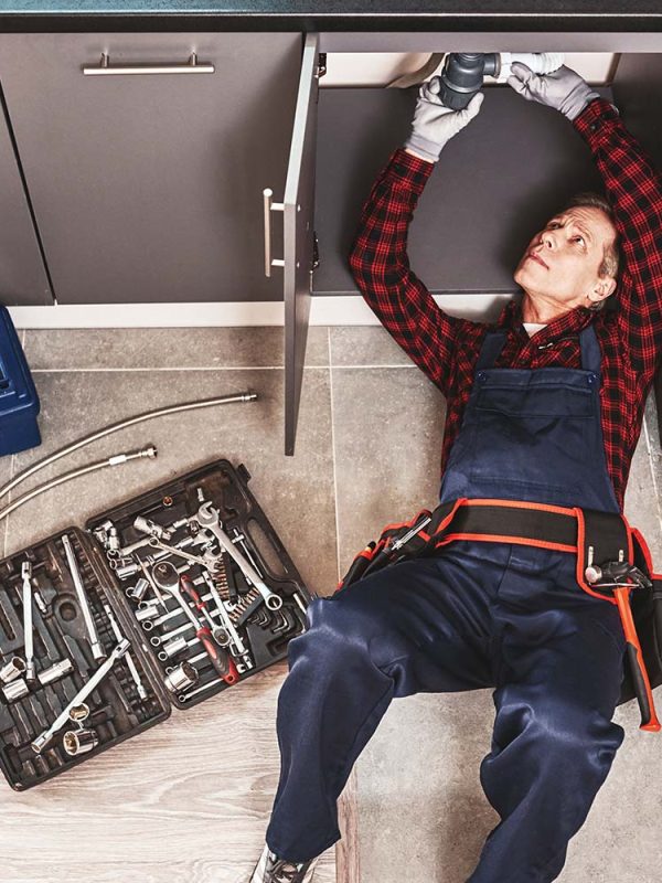 tools-case-top-view-of-seniour-handyman-repairing-resize.jpg
